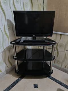 LG LCD 26" TV with a black trolley.