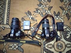 Nikon d3400 with sigma 70-300mm and canon 4000d with canon 75-300mm