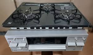 japani 3burner dubble grill timer marbal pitting gas stove model 2023