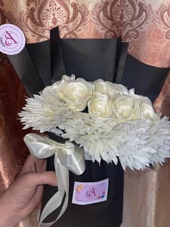 artificial flowers bouquet with chocolate heart