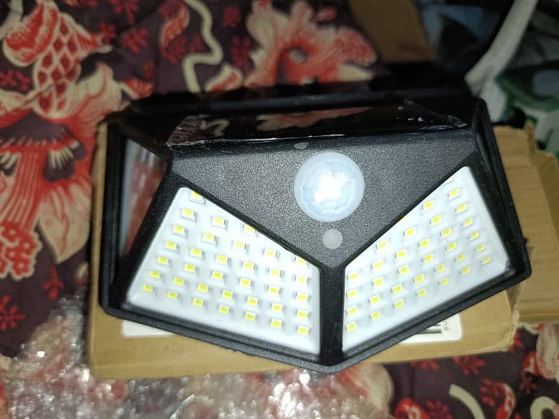 100led solar wall lamp outdoor motion sensor light 3