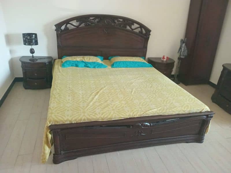 King size bed with side tables, mattress and dressing table. 7