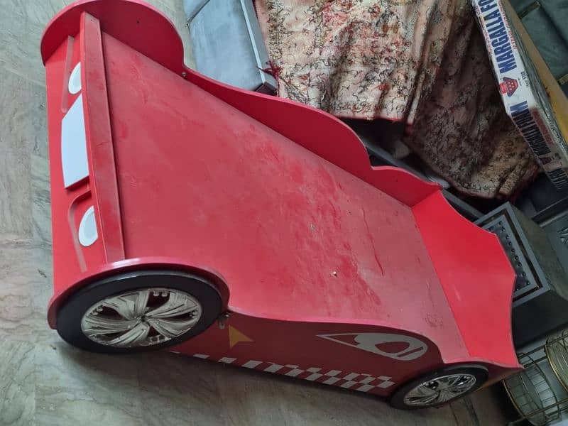 1 racing car themed bed and two hello kitty beds. best for kids 0