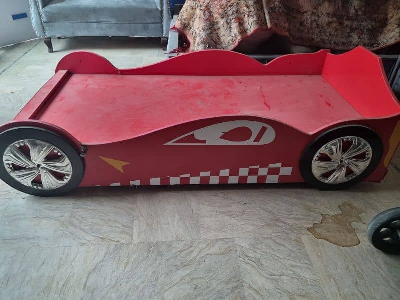 1 racing car themed bed and two hello kitty beds. best for kids 1