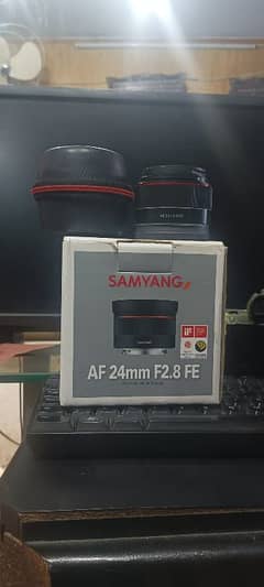 samyung E mount 24mm . 2.8  box  both caps 10/10