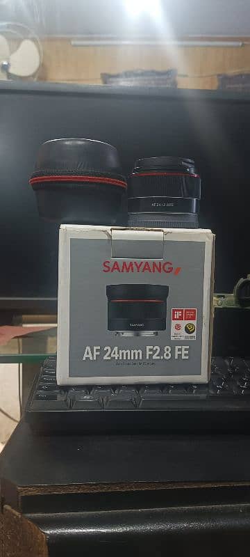 samyung E mount 24mm . 2.8  box  both caps 10/10 0