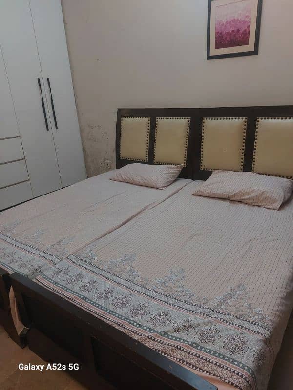 Two single beds with a side table (without mattress) 2