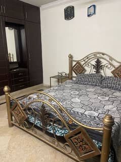 Double iron bed for sale with two side tables