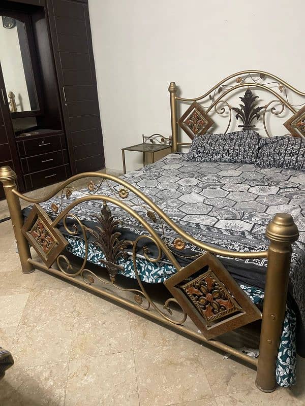 Double iron bed for sale with two side tables 1