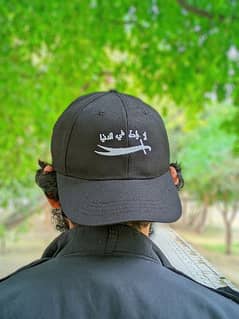 "لا راحة في الدنيا" Stylish Black Cap with Sword Embroidery