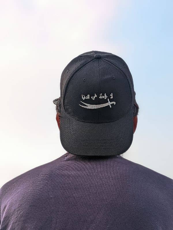 "لا راحة في الدنيا" Stylish Black Cap with Sword Embroidery 1