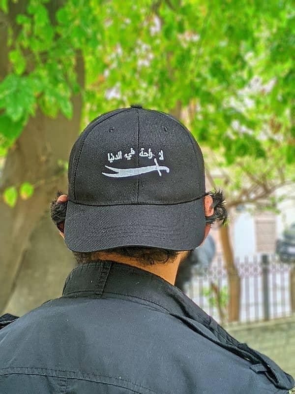 "لا راحة في الدنيا" Stylish Black Cap with Sword Embroidery 2