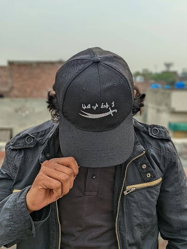 "لا راحة في الدنيا" Stylish Black Cap with Sword Embroidery 3