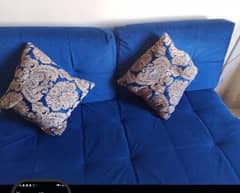 blue sofa set with cushion