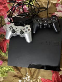 PS3 slim slightly used with 2 controllers