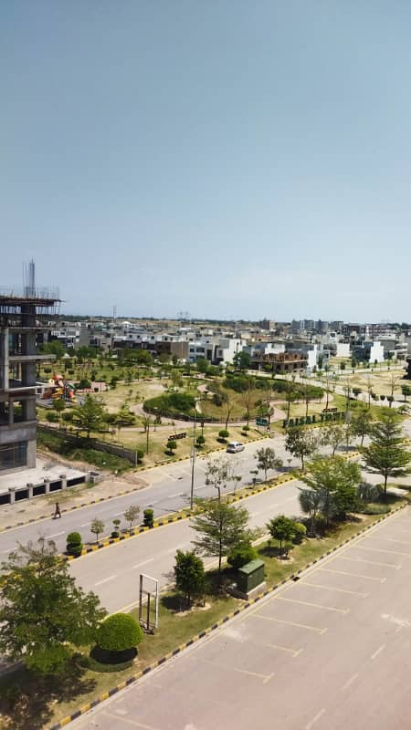 10 marla main double road plot available for sale in Faisal town block A 19