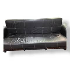 black faux leather futon sofa bed.