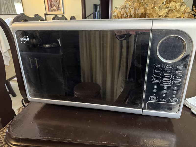 Kenwood microwave, never been used so it's dusty. 1