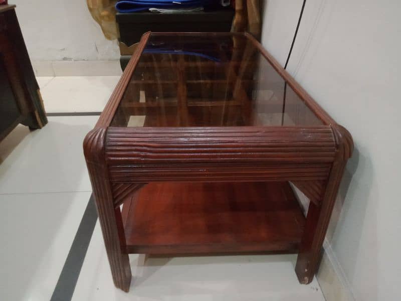 wooden central table made of sheesham wood having brown glass top 1