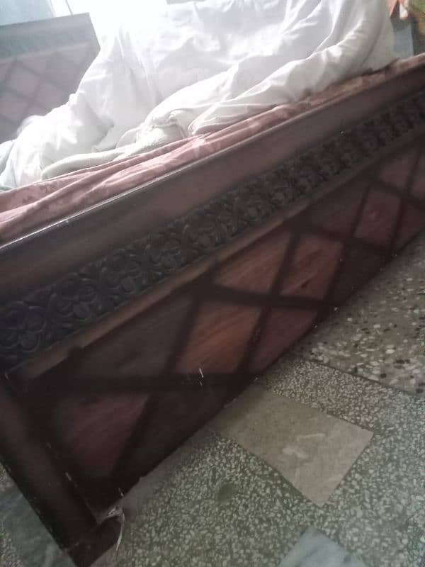 wooden bed hy. . . . 0