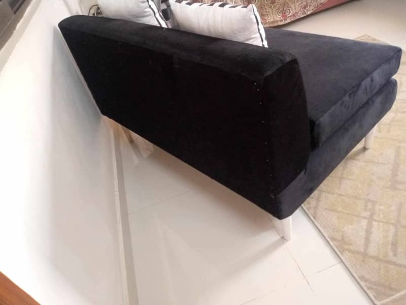 2 seater black  velvet sofa  with cushions . 2