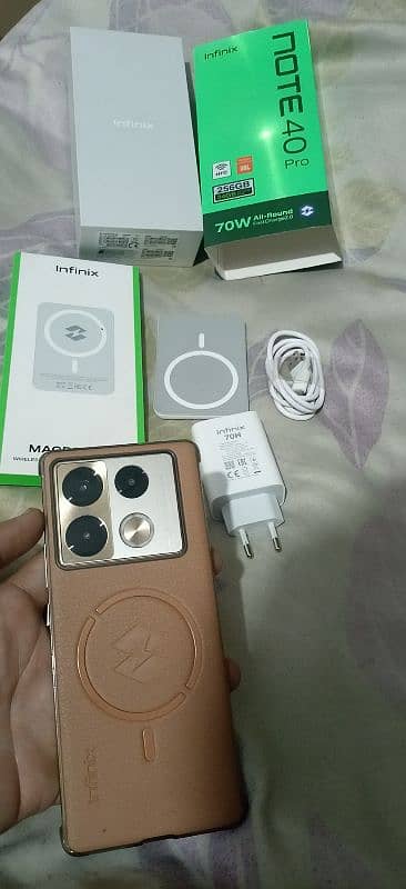 Infinix Note 40 Pro with All Box Adapter Cable and wireless Charger 1