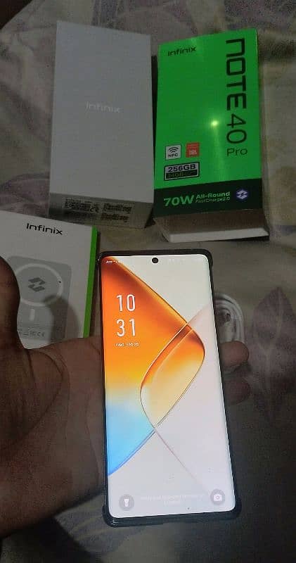 Infinix Note 40 Pro with All Box Adapter Cable and wireless Charger 3