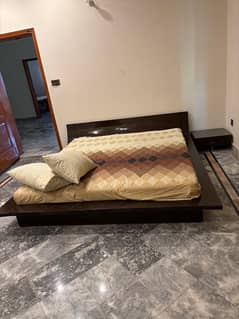 used wooden bed plateform style along with matress and 2 side tanles