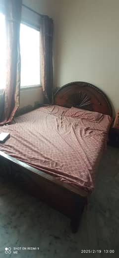 wooden double bed