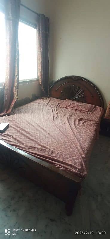 wooden double bed 0