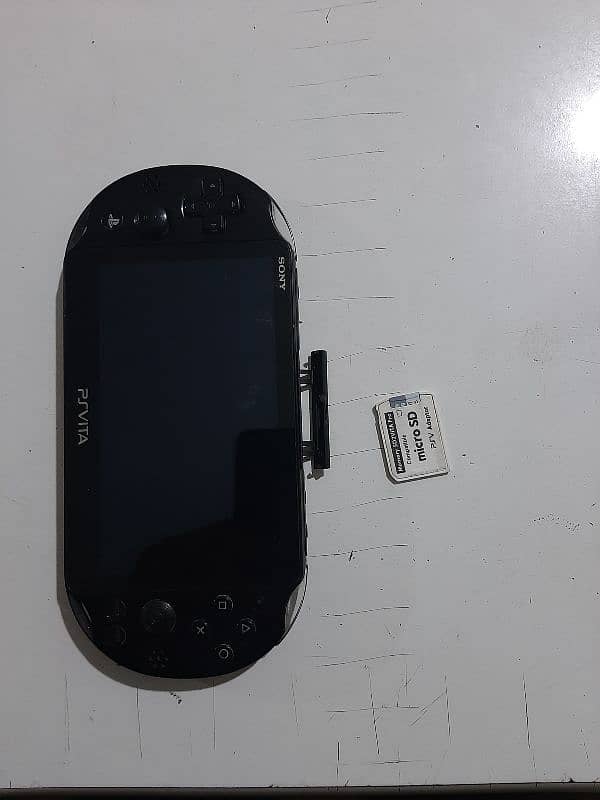 ps vita slim jailbreak with original charger and 64 gb sd card 1