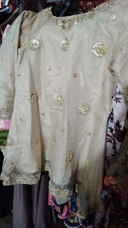 Dull gold boutique frock with sharara and organza dopatta 0