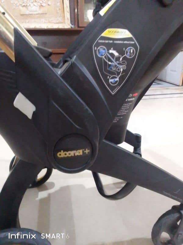 doona stoler 3 in one. cot+car seat+stoler 9