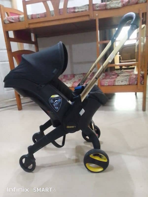 doona stoler 3 in one. cot+car seat+stoler 13