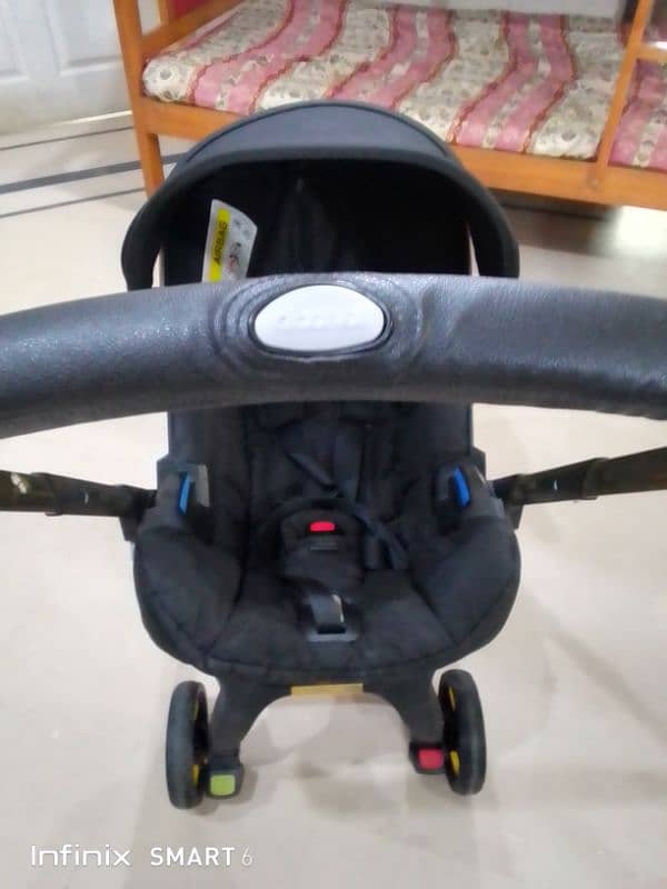 doona stoler 3 in one. cot+car seat+stoler 14