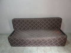 sofa cum bed with two cushions