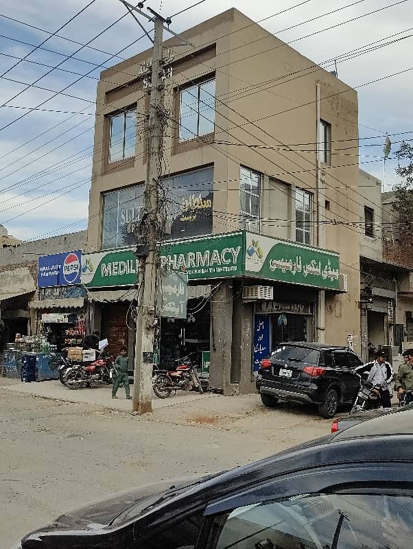 3 Story Corner Commercial Plaza Facing Canal Road Prime Location Ring Road SL3 ki only 1 Mint Drive 55 K se 65 k Rent Income Registery Intqal plaza 12