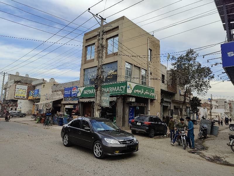 3 Story Corner Commercial Plaza Facing Canal Road Prime Location Ring Road SL3 ki only 1 Mint Drive 55 K se 65 k Rent Income Registery Intqal plaza 13