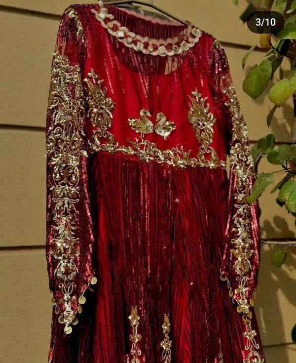 A beautiful mahroon maxi fully covered with sequence and sitara 0