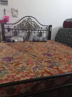 Bed with iron stand