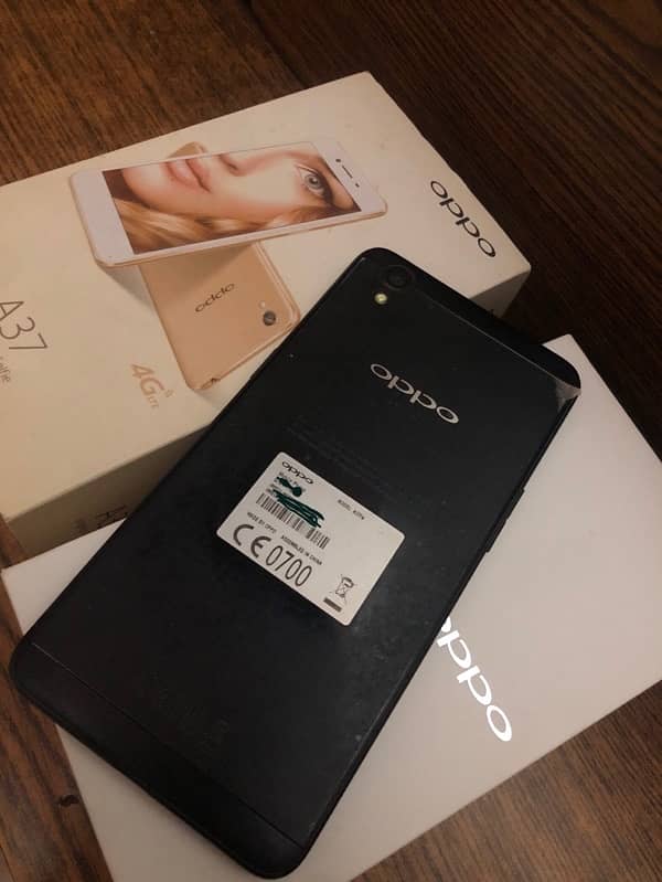 Oppo A37fw black 2/16 one hand used sealed. 0