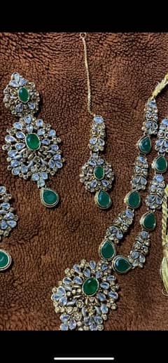 green artificial jewelery set