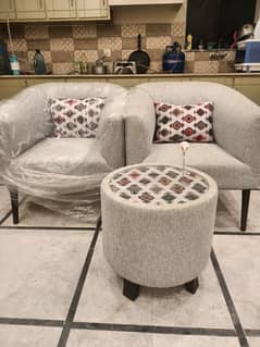 Two sofa chairs with table