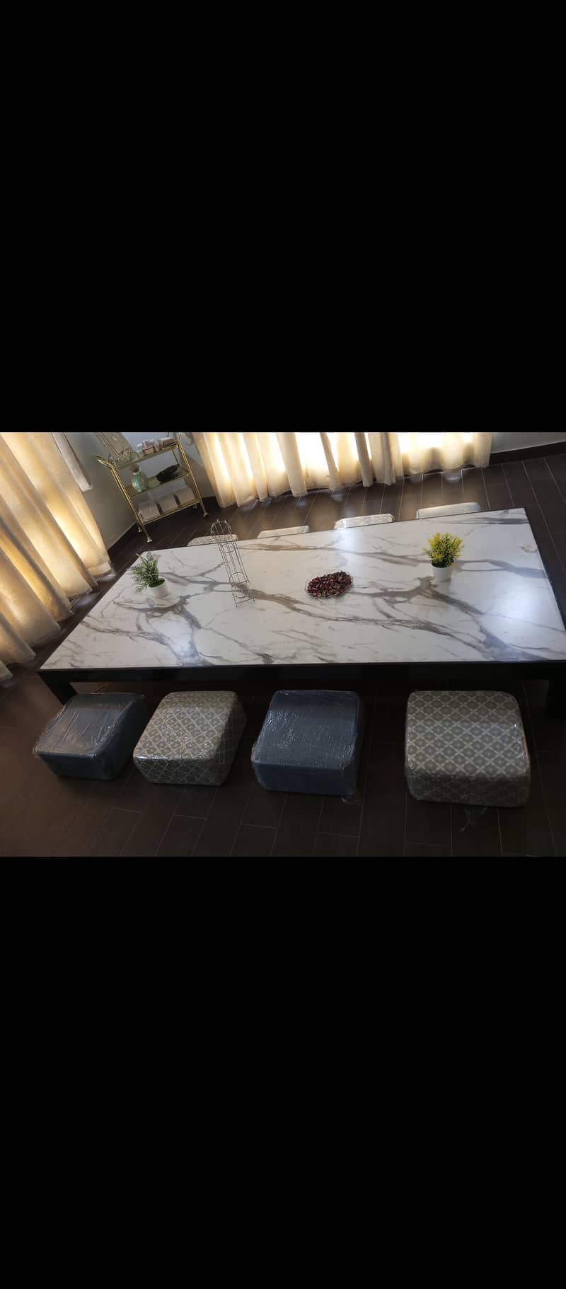 Floor sitting dining table with 8 wooden stools. 2