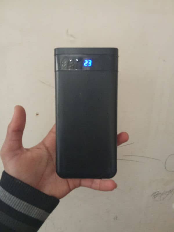 20,000mAh powerbank | shared by two ports . 4