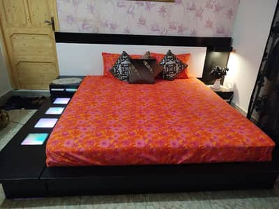 double bed with dressing with curtains