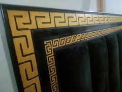 Golden black double bed with posish