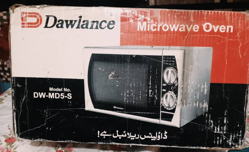 "Slightly Used Dawlance MW  – 700W, PKR 12,000!" 3