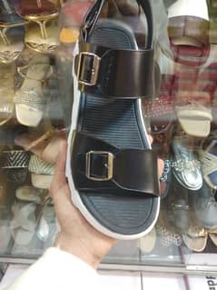 Black sandals in white sool