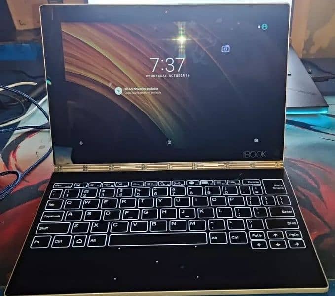 The Lenovo Yoga Book YB1-X90F Tab 4G+64GGR-US is a 2-in-1 tablet 0